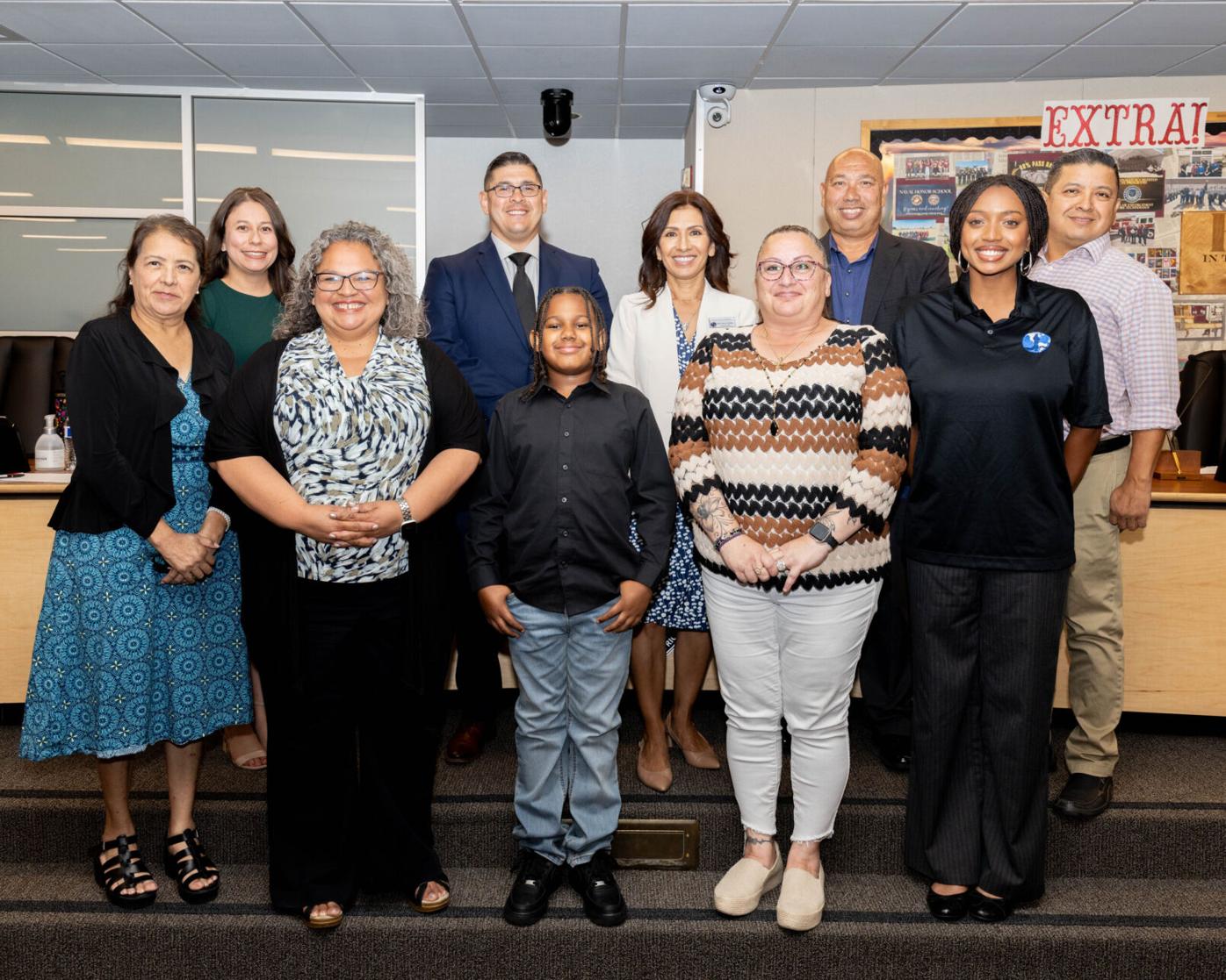 School board with Cyrus Moss after the vote